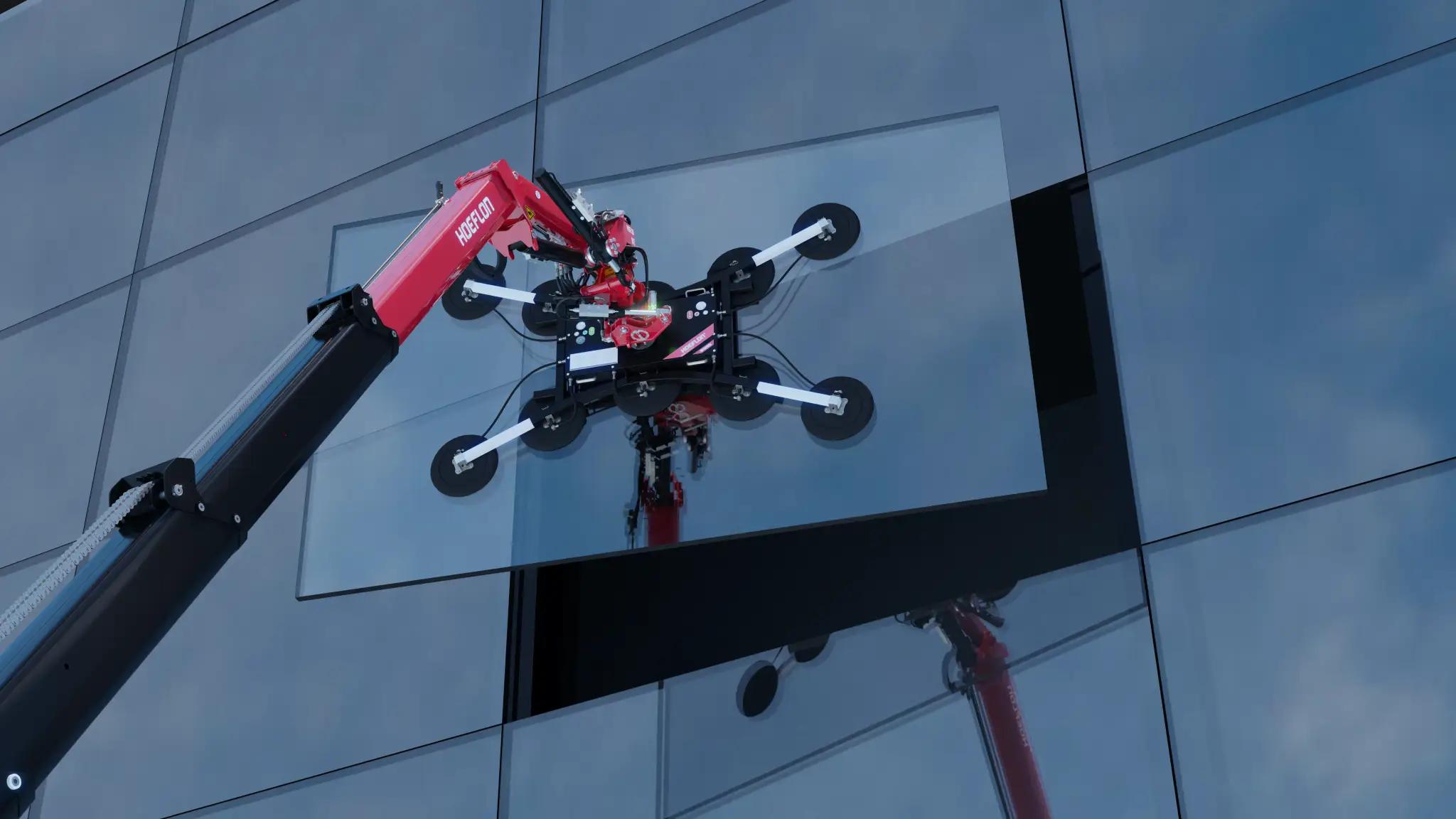 Hoeflon crane with glass suction device placing glass on a building.