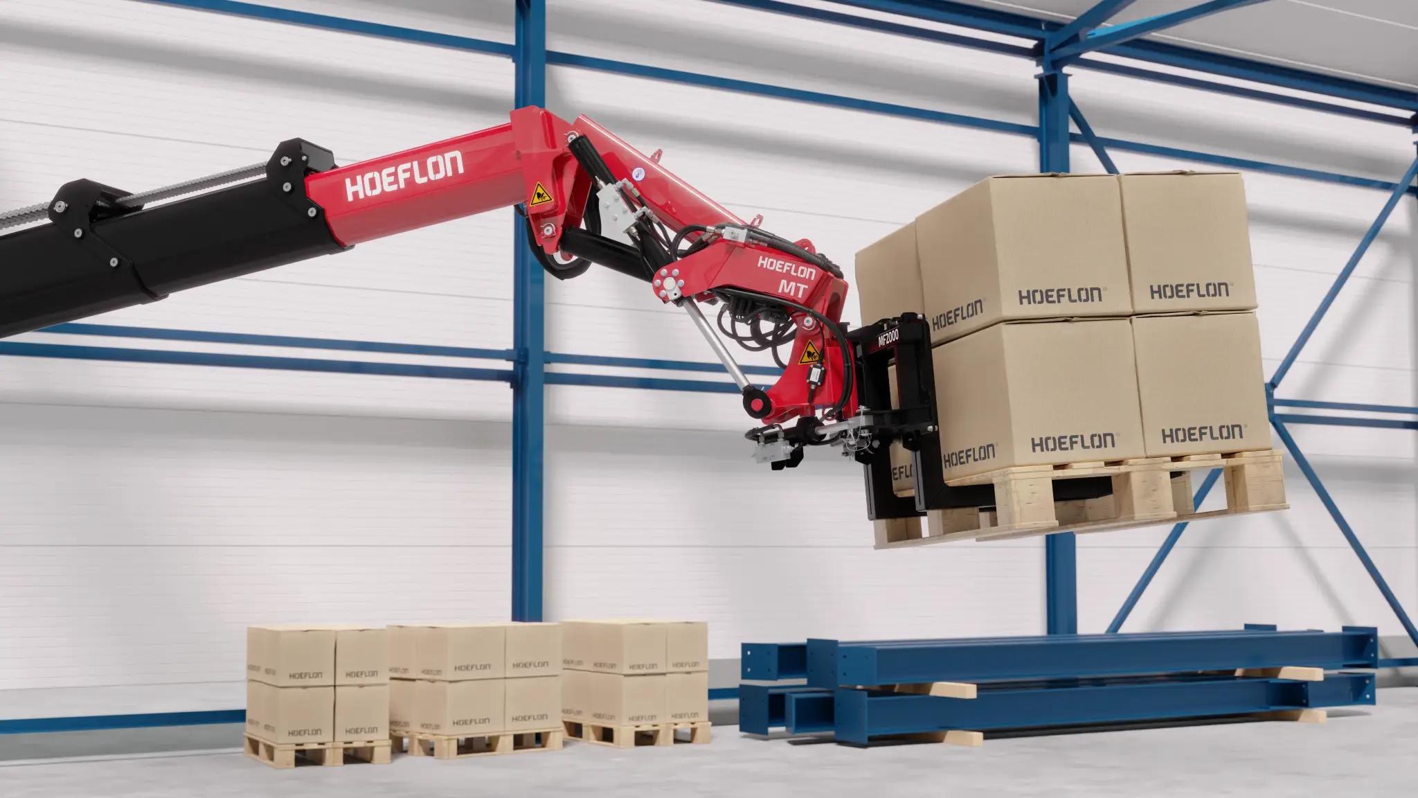 Hoeflon Multitool lifting a pallet of boxes in a warehouse.
