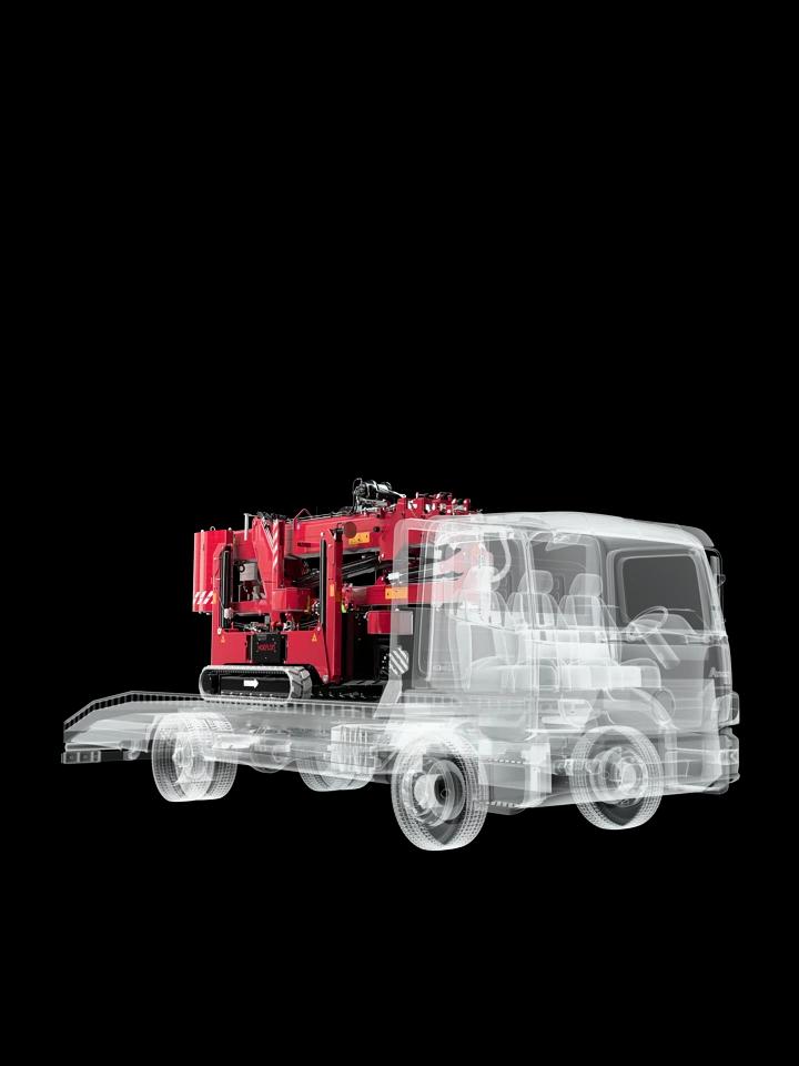 Hoeflon C10e in transport mode on a compact truck.