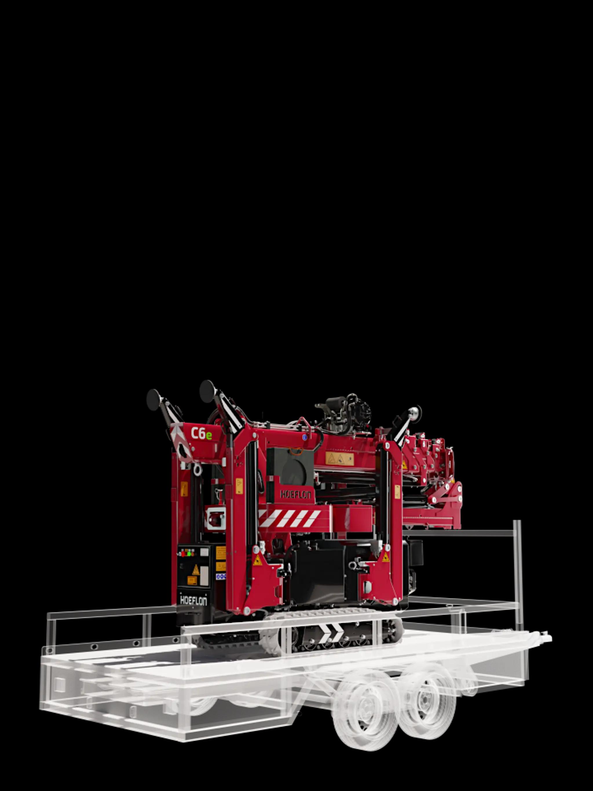 Hoeflon C6e in transport mode on a compact trailer.