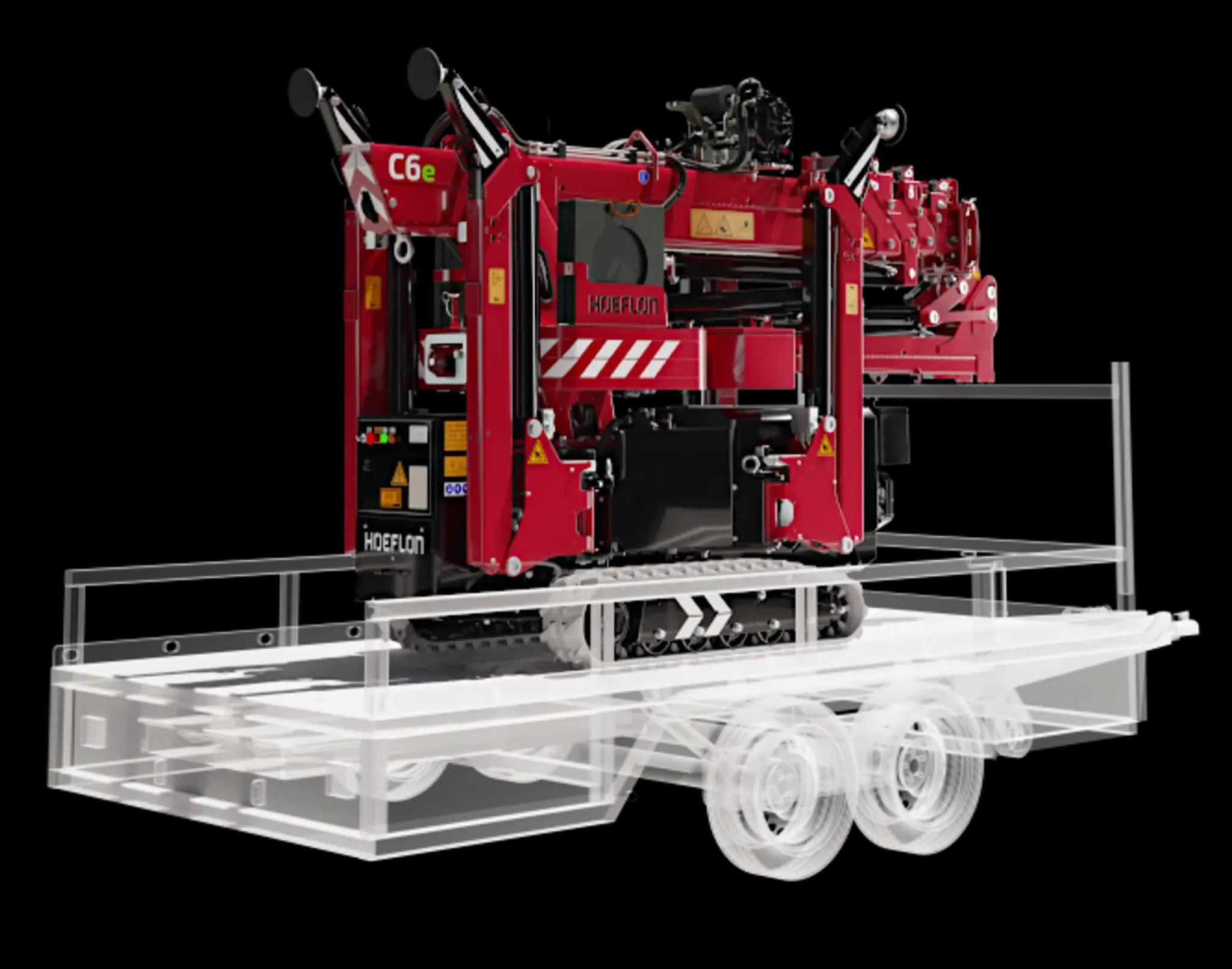 Hoeflon C6e in transport mode on a compact trailer.