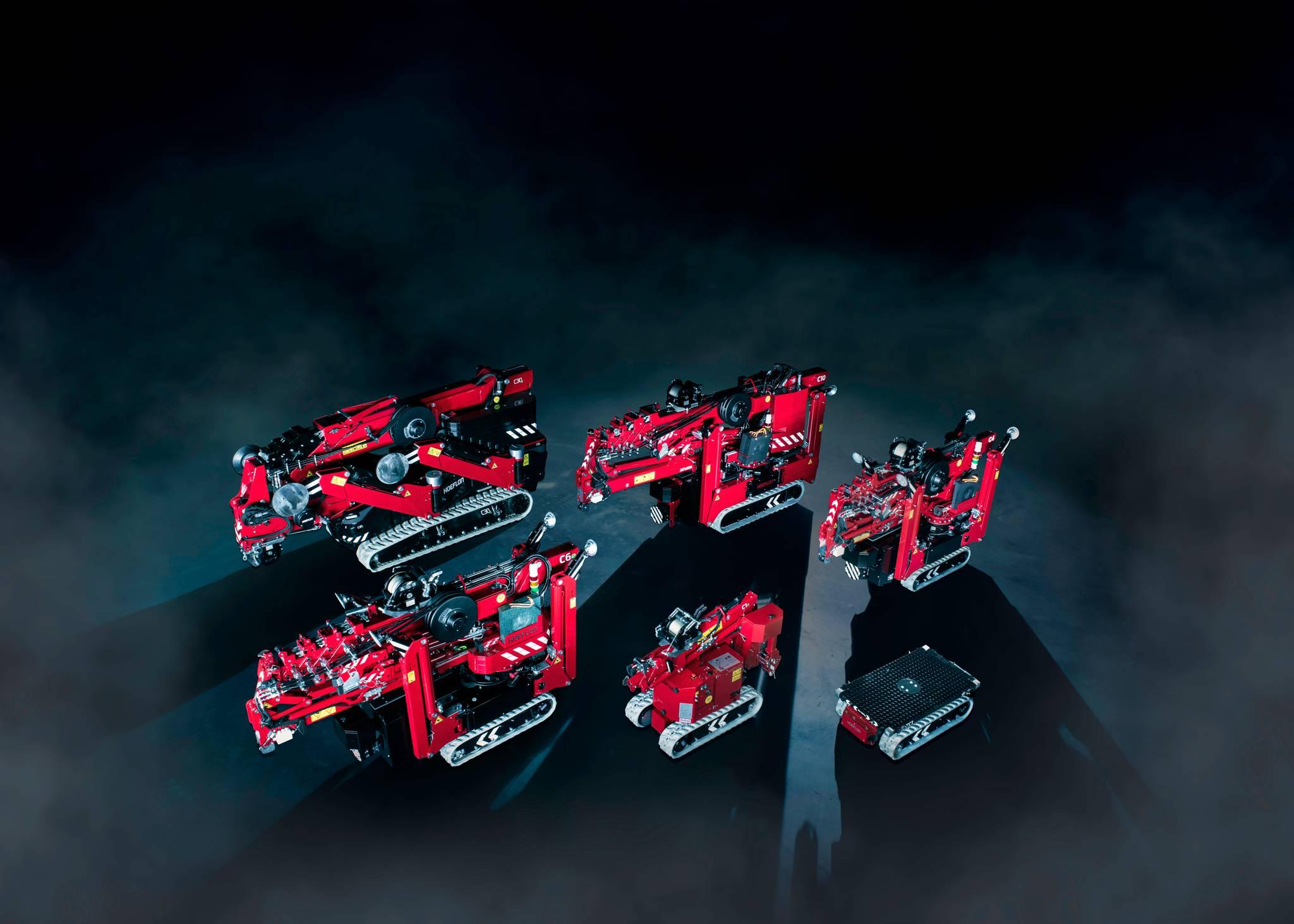 Image of Hoeflon compact cranes and a carrier.