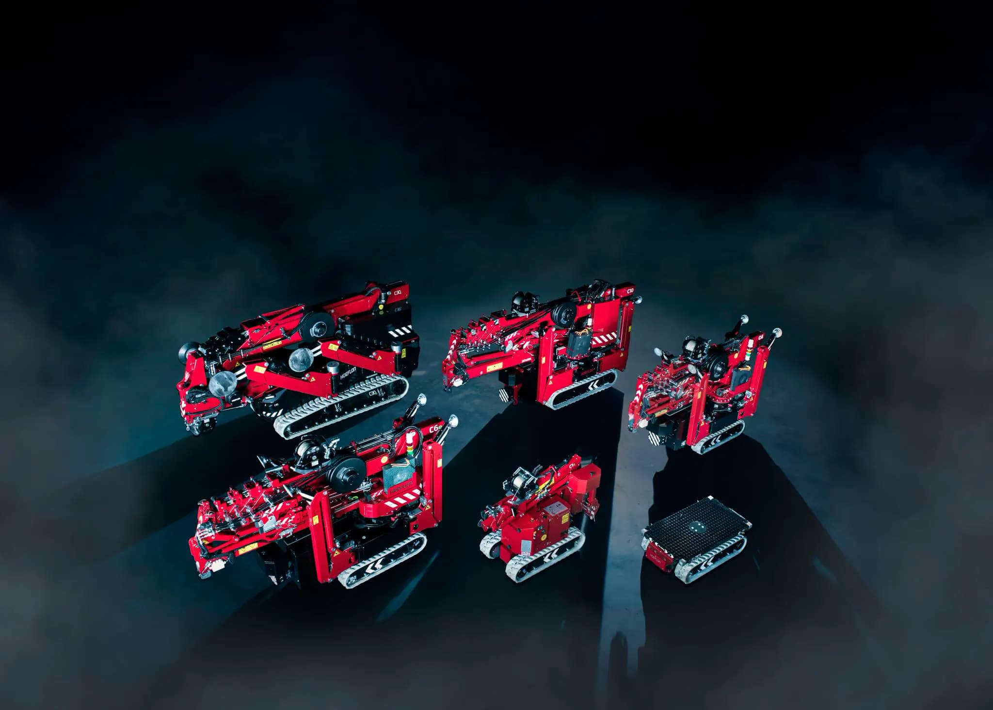 Image of Hoeflon compact cranes and a carrier.